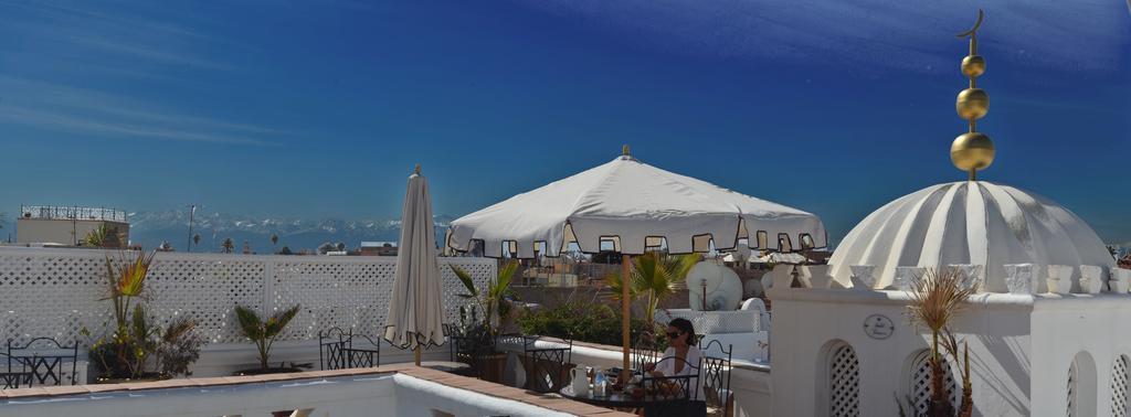 Riad Palais Des Princesses & Spa Marrakesh Exterior foto A terrace in Morocco